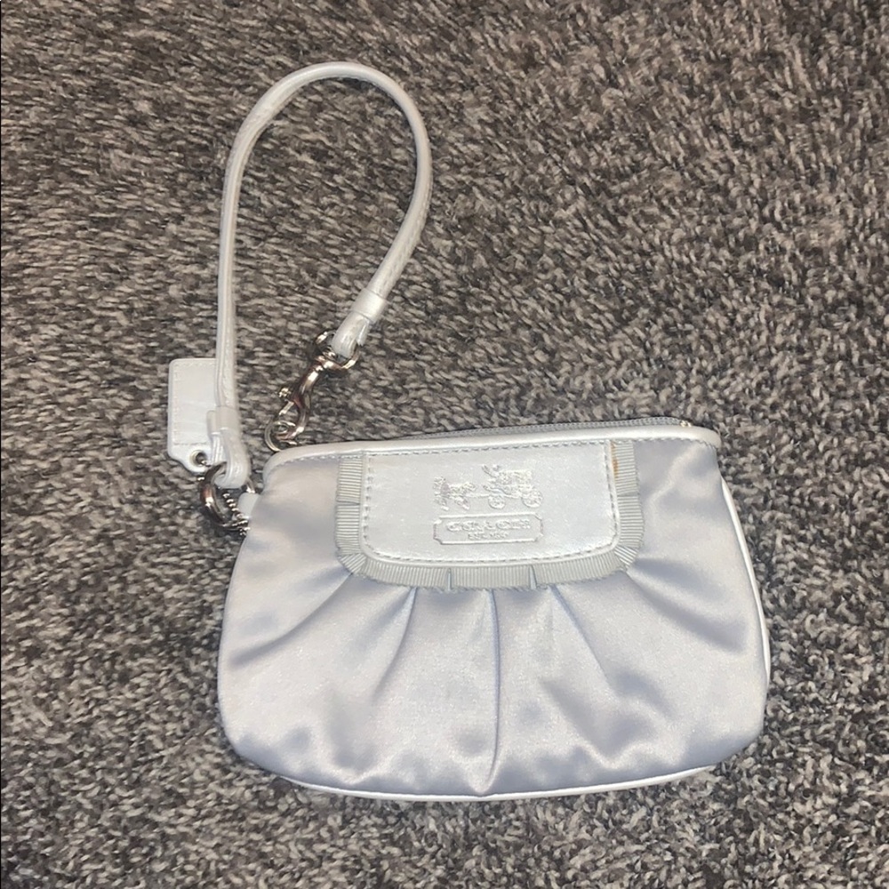 Silver, silky Coach wristlet